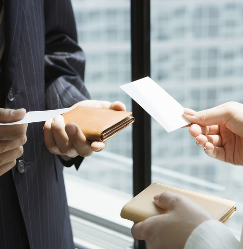 Formal business card exchange illustrating Japanese communication etiquette