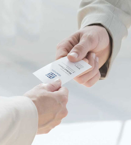 A TMCreation designed client business card being handed out