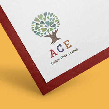 Playful and colourful logo design sample shown on a clean card mockup, reflecting a friendly and approachable branding style
